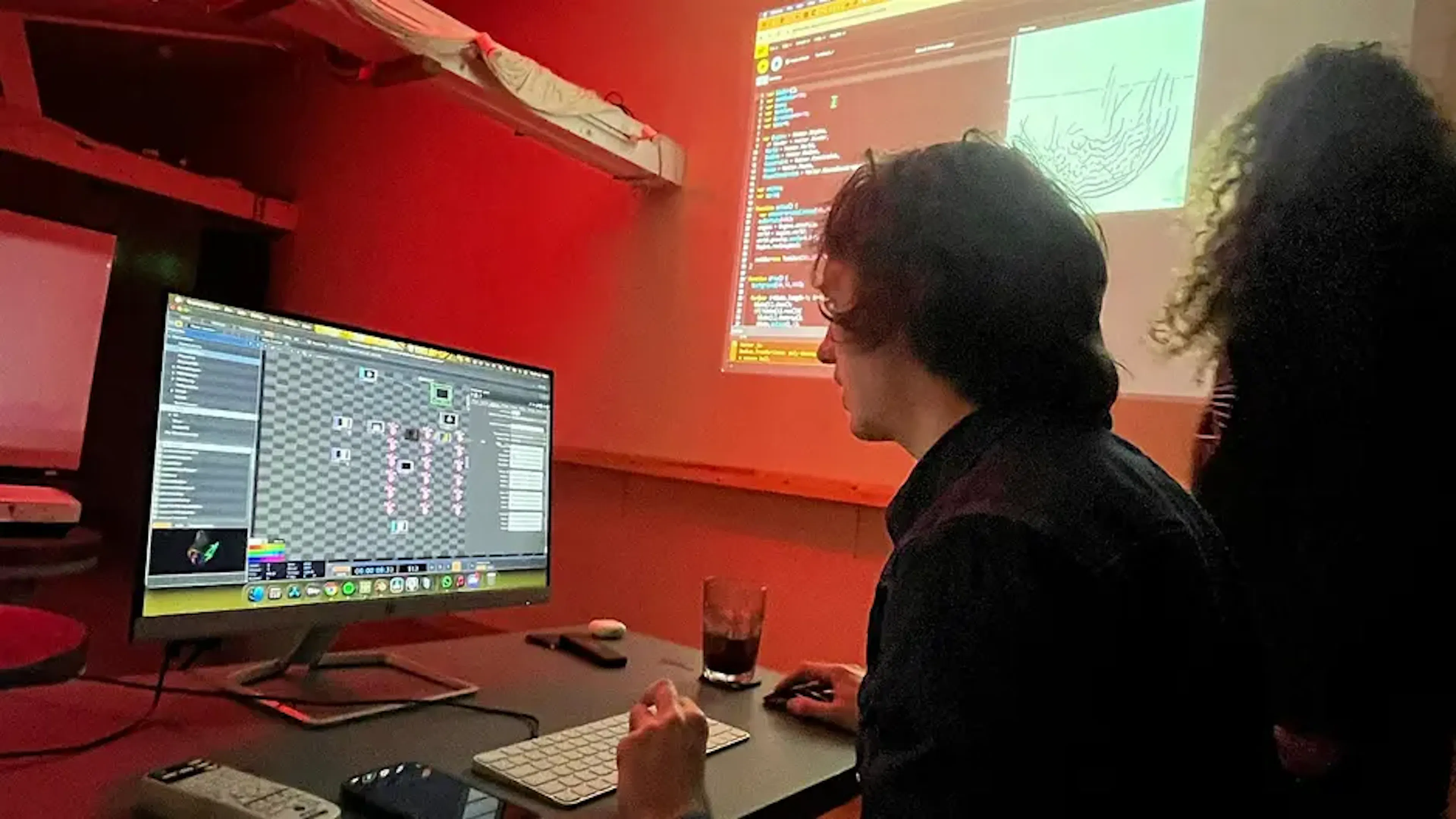 Felix Colbert showing work at the audio visual meet-up with Kyle Roberts in the background. 