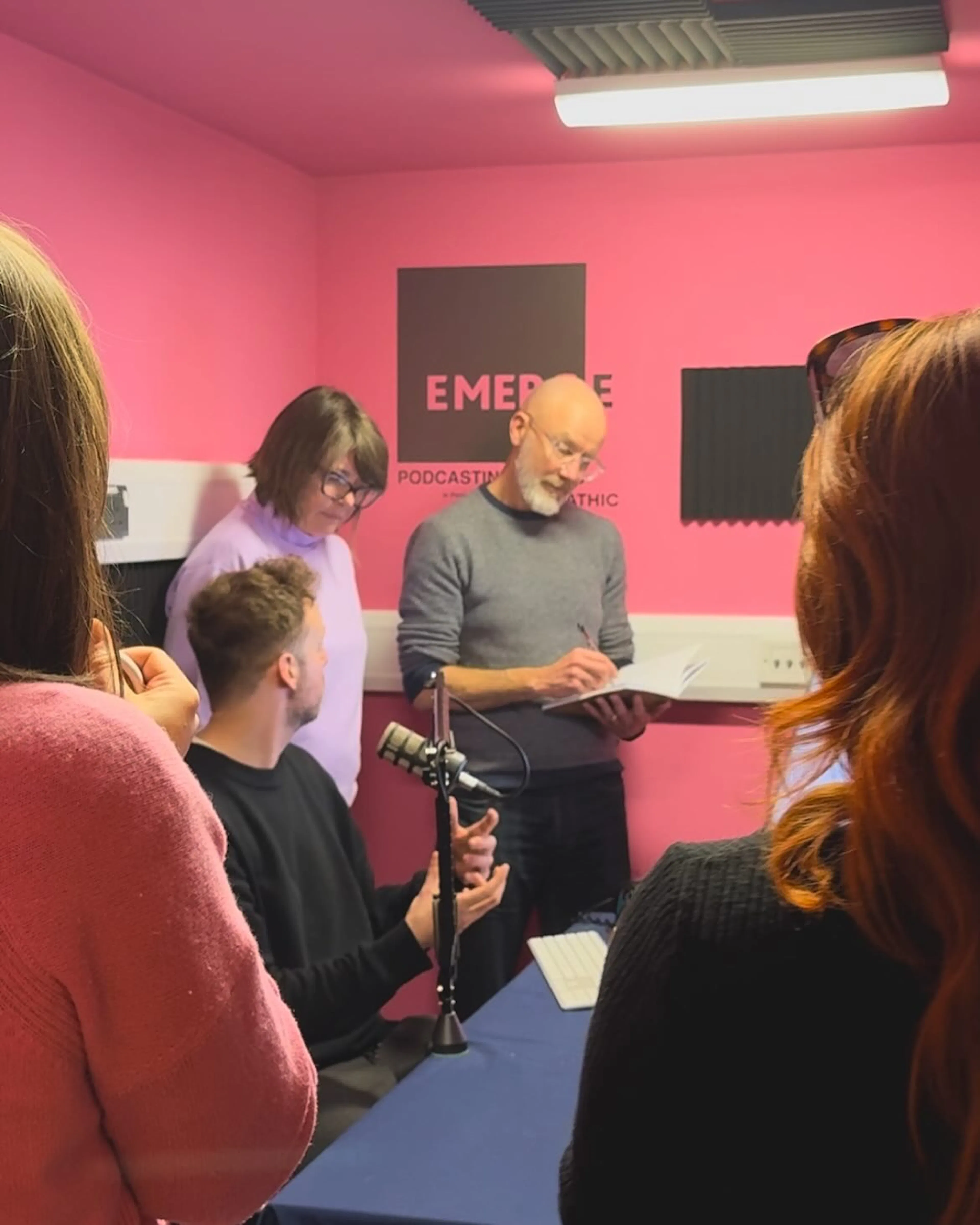 Workshop participants working with Nigel Fryatt in the EMERGE podcasting room.