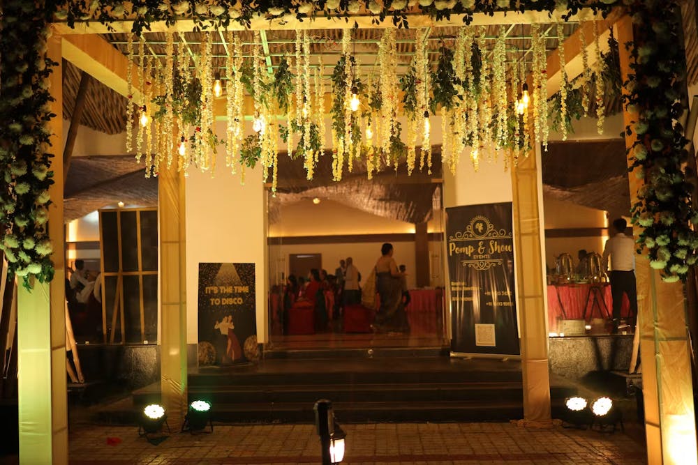 Flowers hanging from the roof of a wedding gate