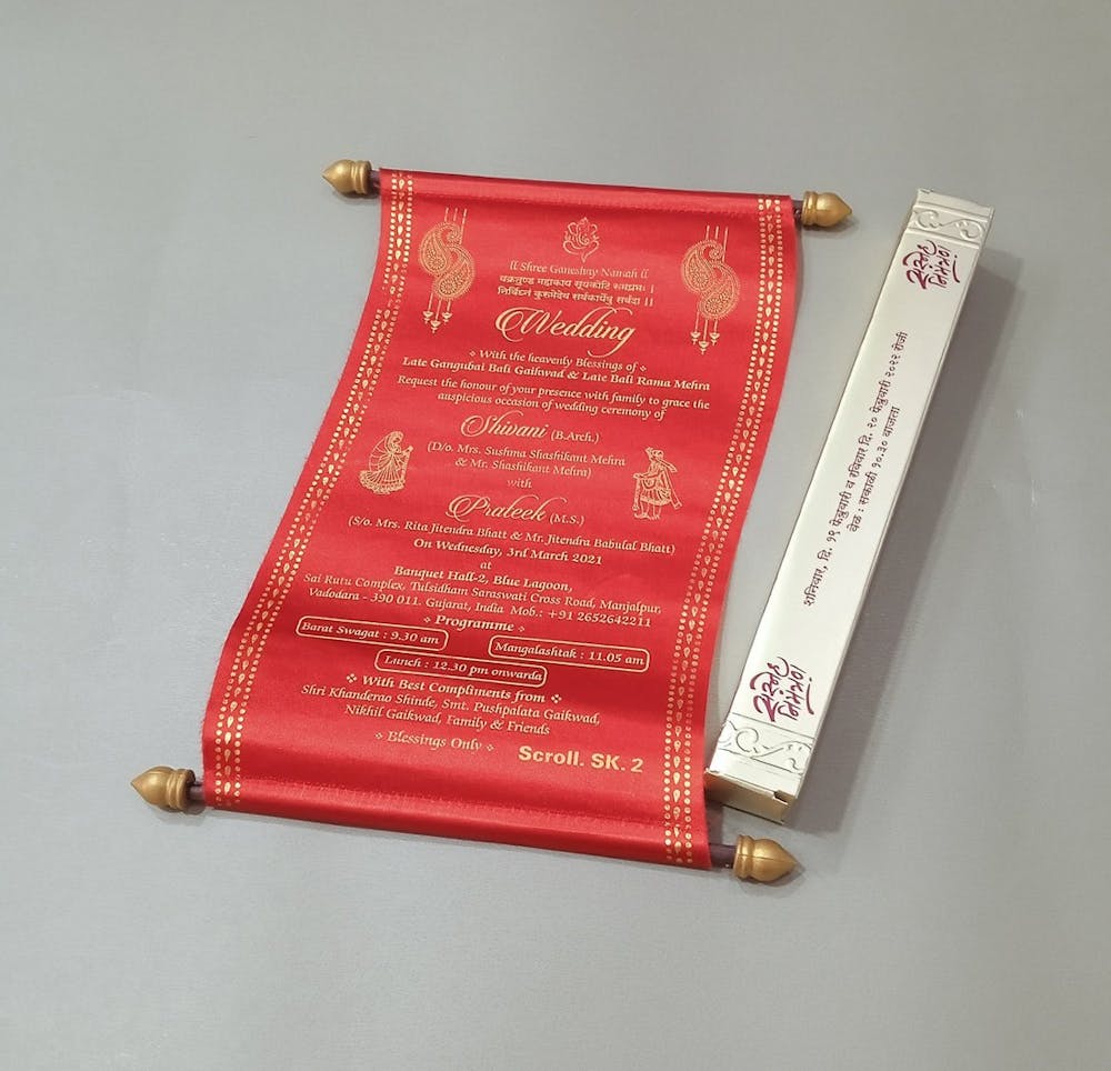 A scroll message invitation wedding card for Bengalis