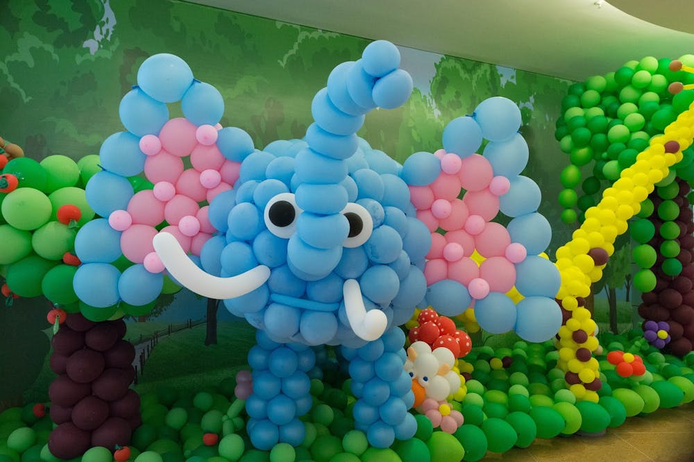 Picture of a cute elephant made from colorful balloons