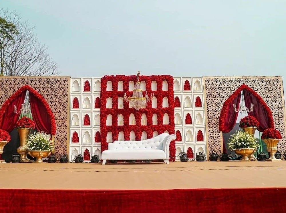 A grand Red rose decorated wedding stage
