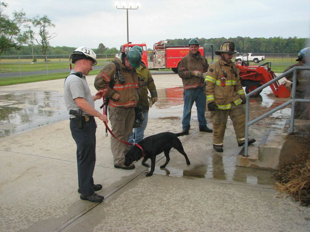 John and K-9 Tanya working a fire scene after returning home from training.