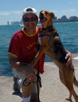Steve Dale and his dog outside by the water