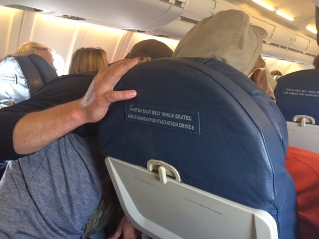 paying attention to distressed man on flight
