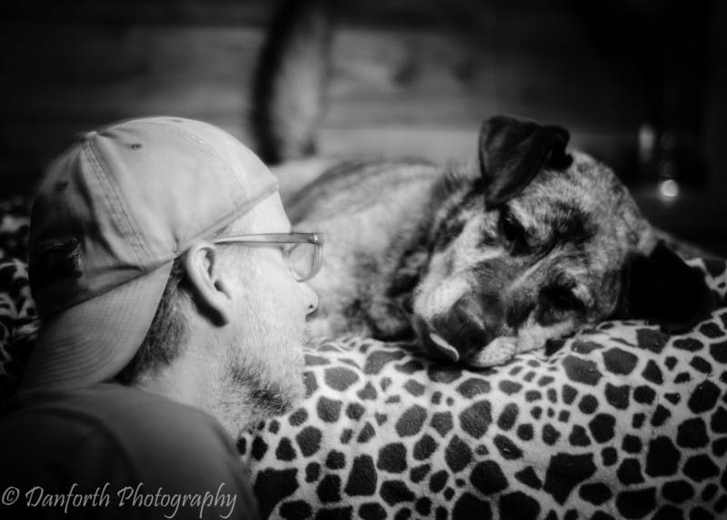 Man looking lovingly at his dog