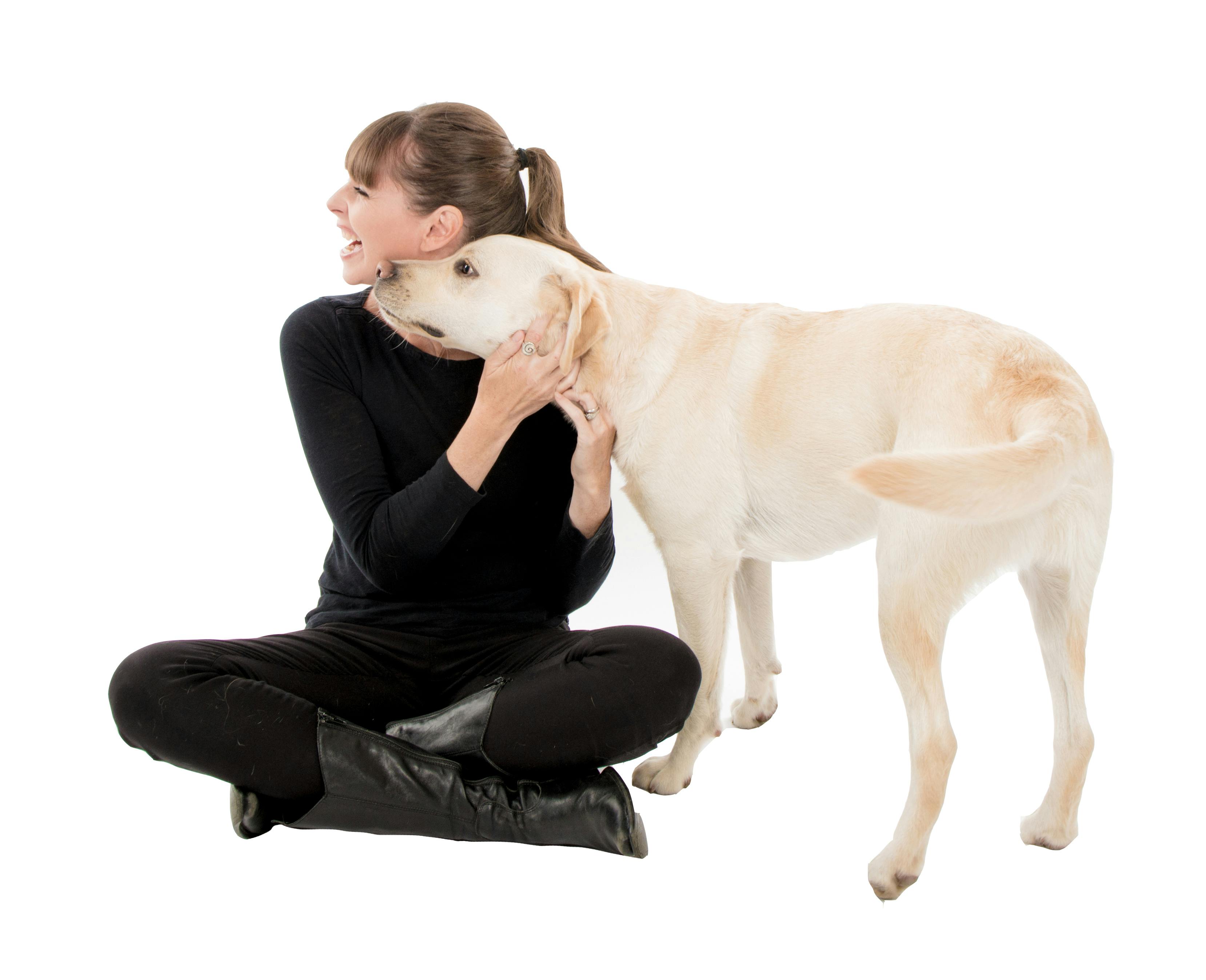 Victoria cuddling with yellow lab