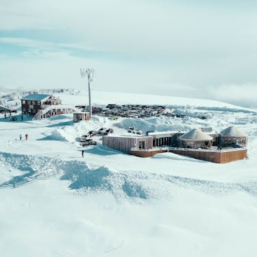 The Skylodge, Hidden Lake Lodge, and upper parking lot at the top of the mountain