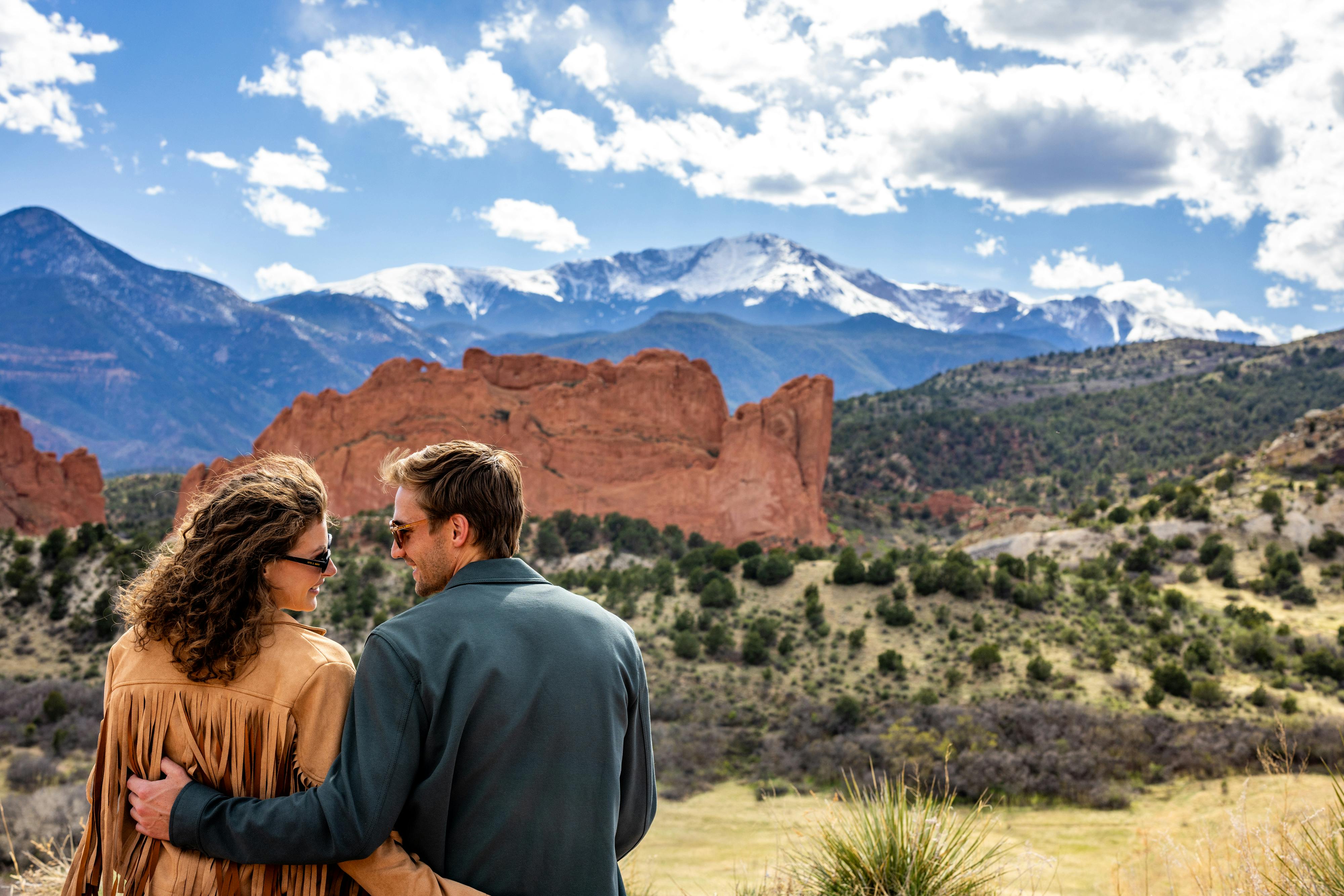 Couple taking in a breathtaking mountain view.