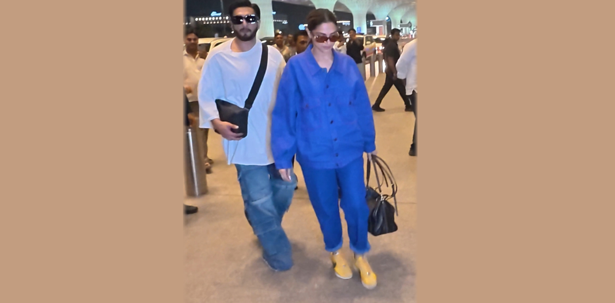 Ranveer turns protective of Deepika at airport