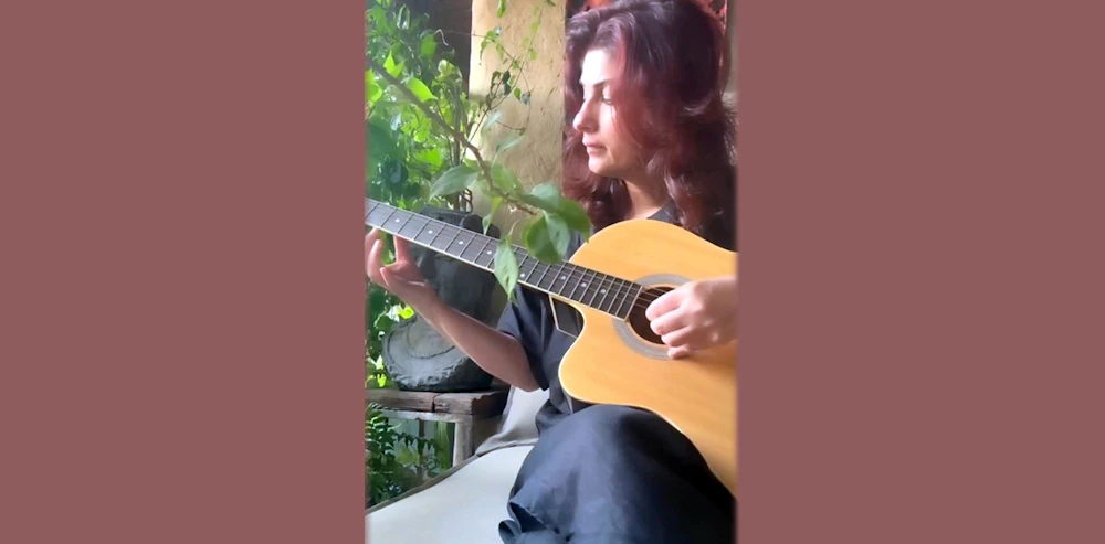 Twinkle learns guitar from her daughter
