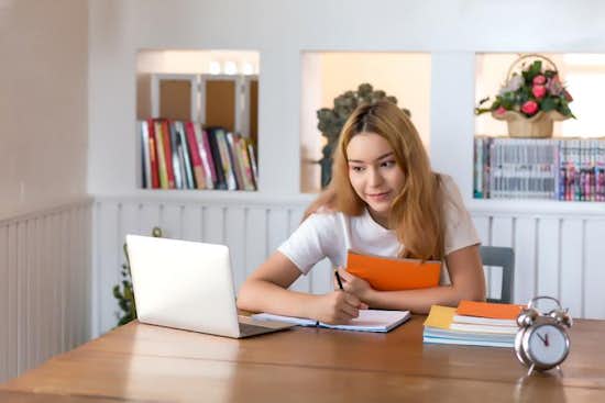 Business high school student taking online course