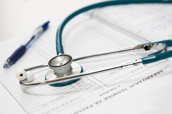 Decorative image of stethoscope, medical chart, and pen. Decorative image of stethoscope, medical chart, and pen.