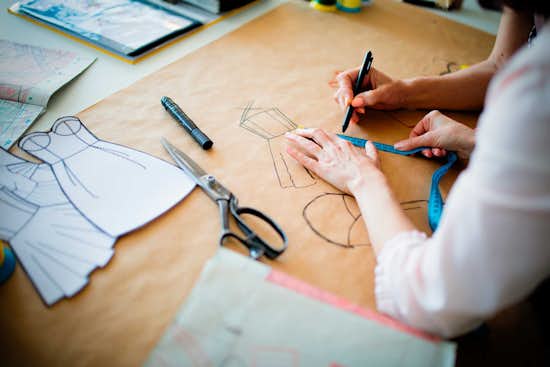 Student working on fashion design project Student working on fashion design project