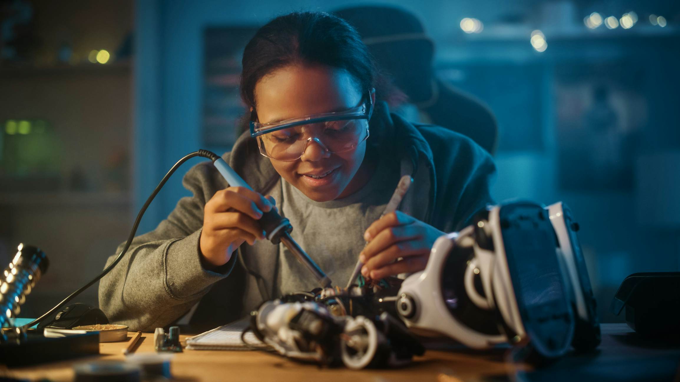 Female student working on a robot