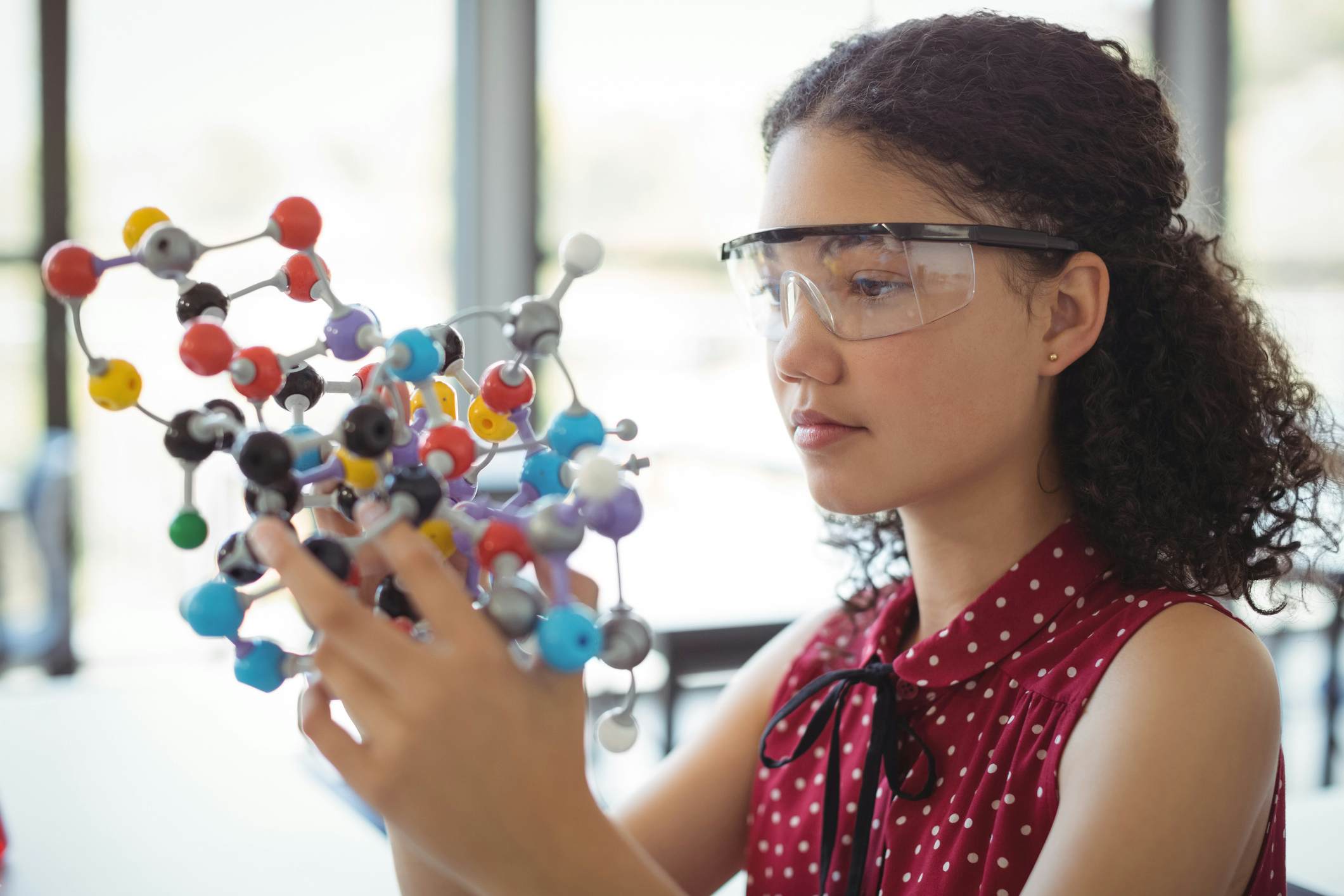 Teen high school student working on a STEM diorama 