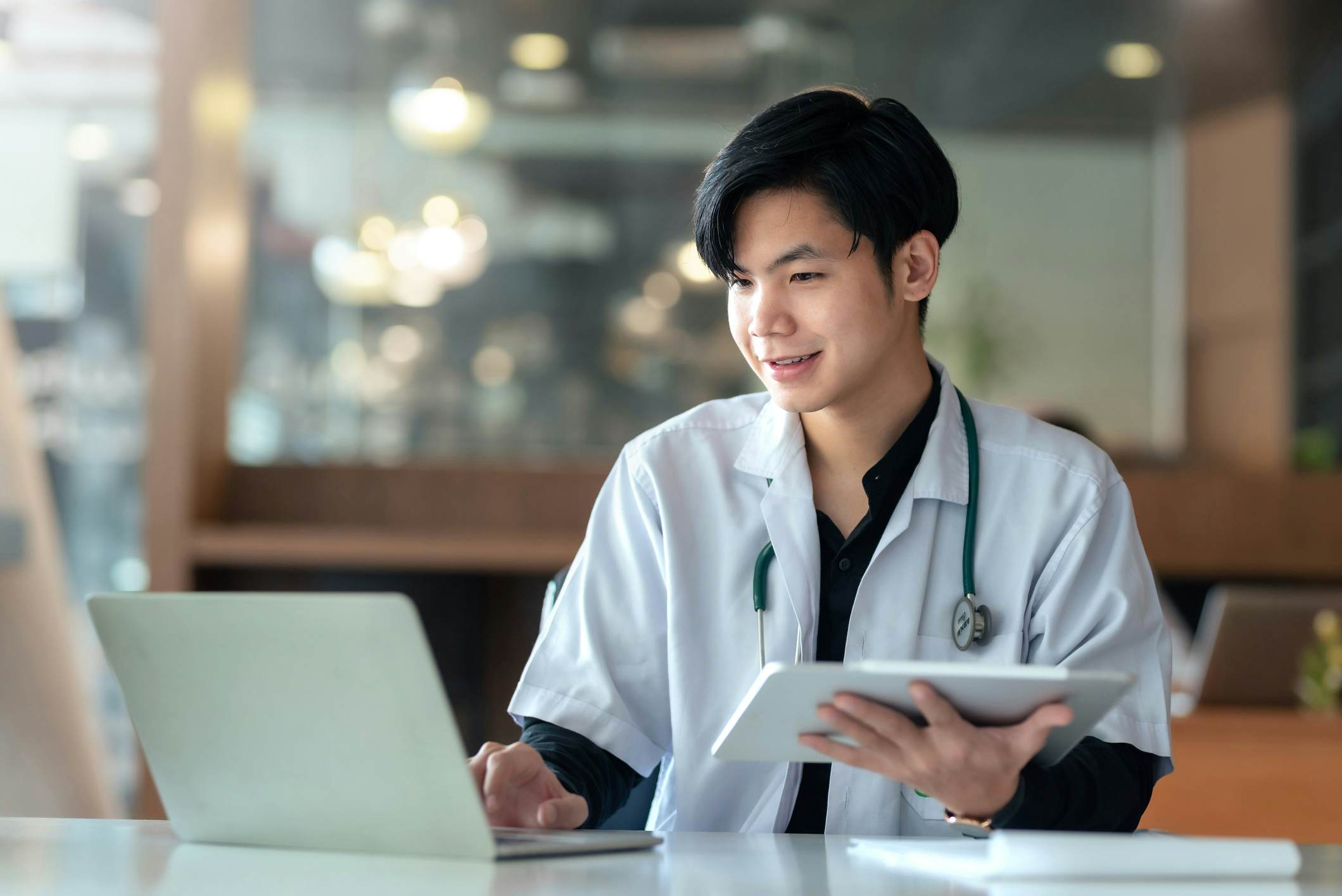 Male student studying medicine on his laptop