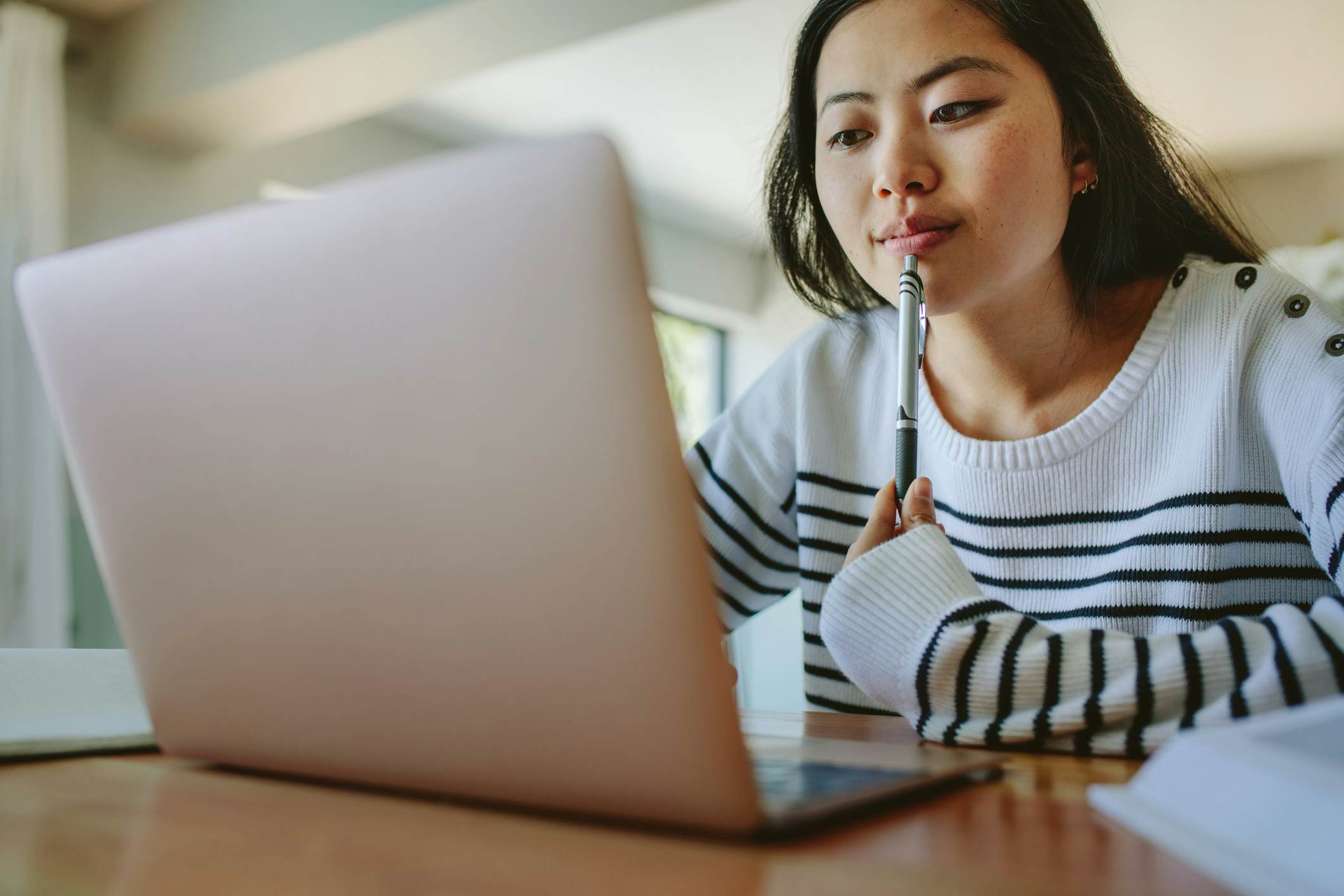 Female student studying on a laptop