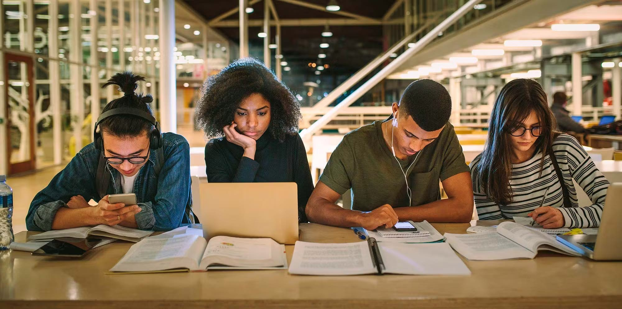 Students studying at table together