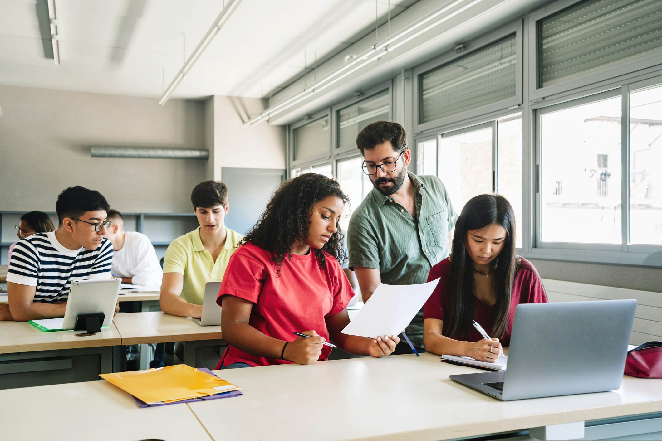 Teacher in a classroom with high school students