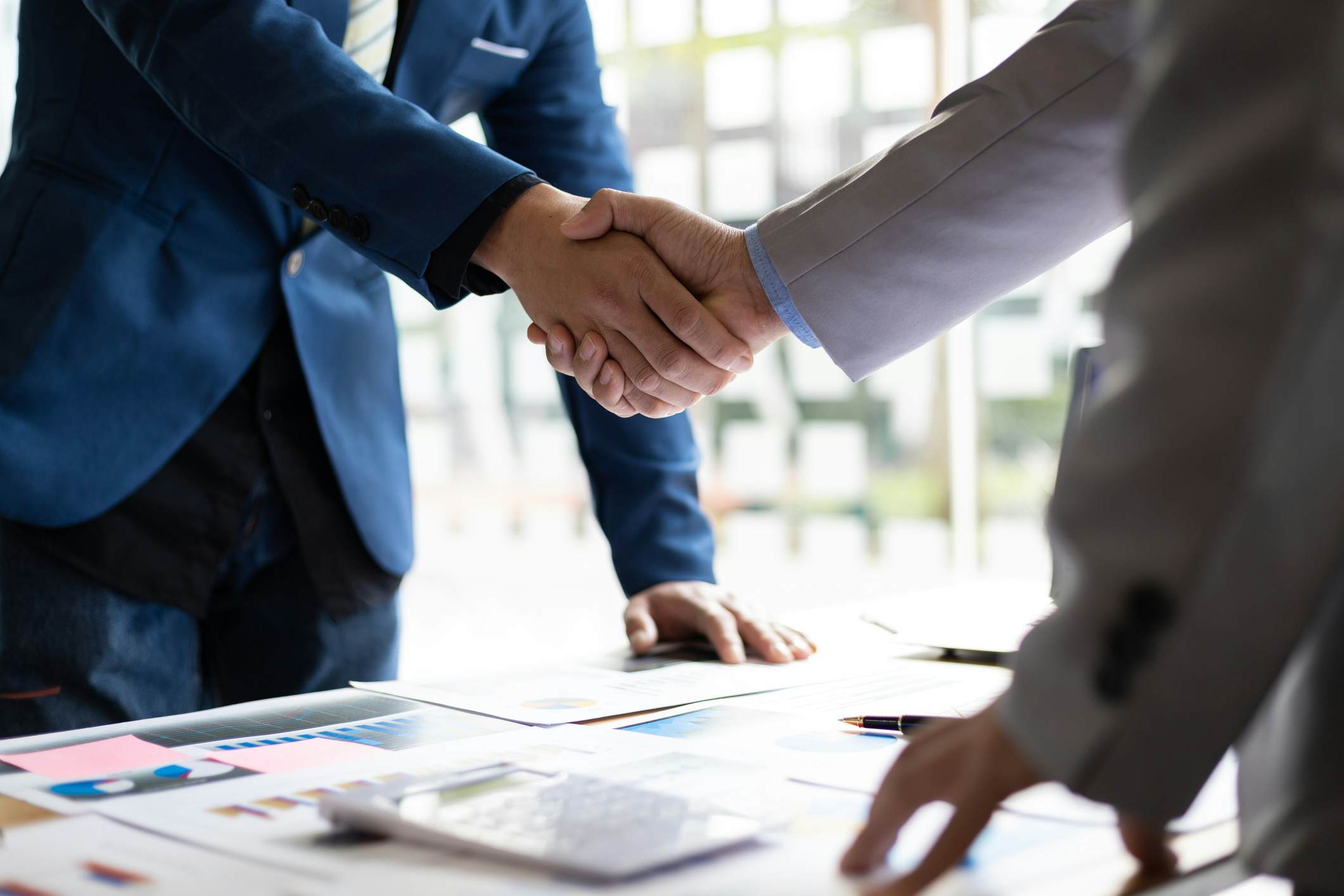 Business partners shaking hands during a meeting