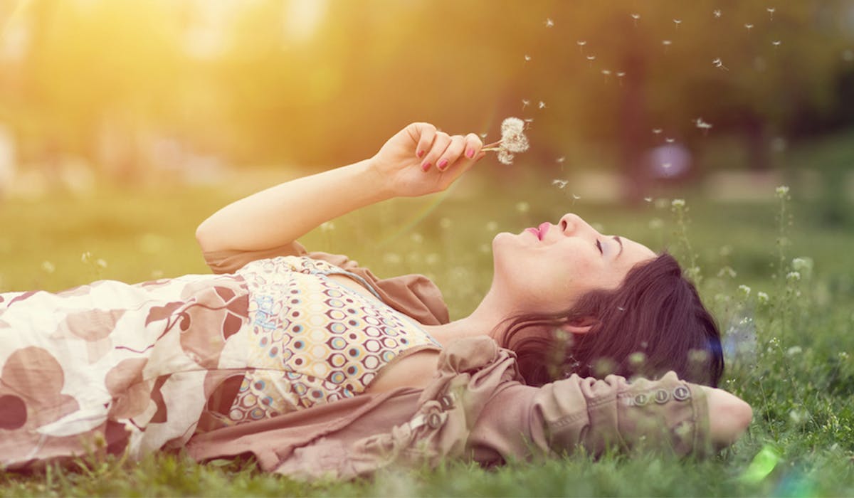 woman laying in grass