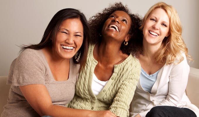 happy middle aged women laughing