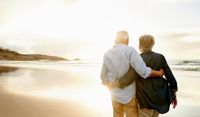 middle age couple at sunset