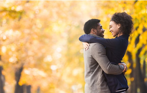 loving couple hugging and looking into each other's eyes