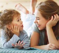happy mom and daughter at home