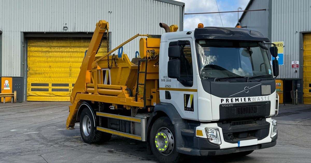 Skip collection truck