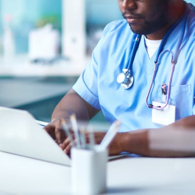 Health Practitioner on Laptop