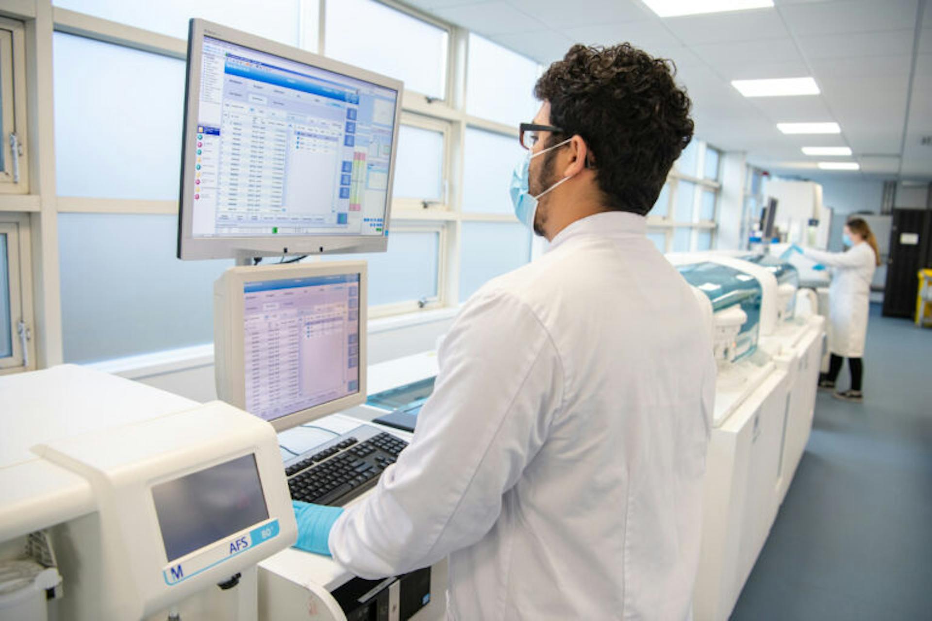 Laboratory Technician Checking Samples