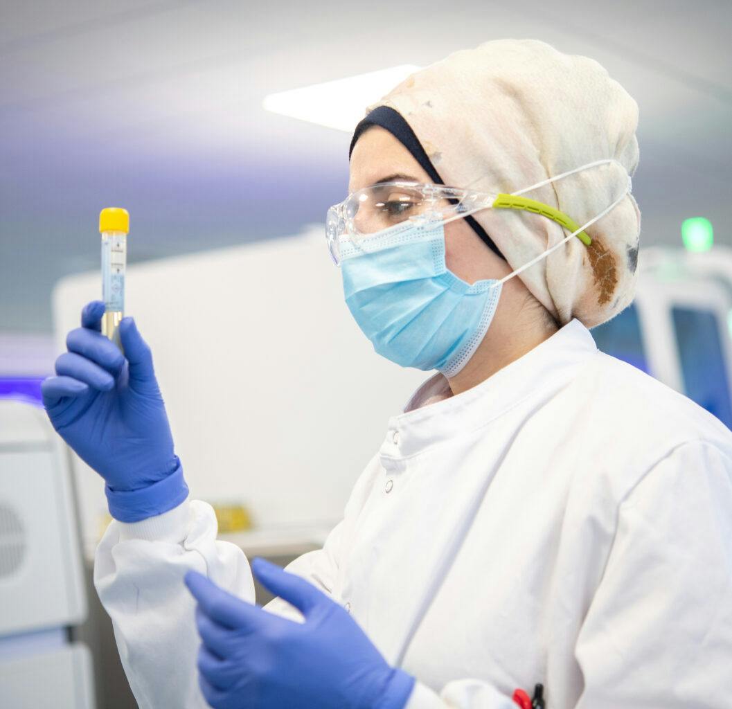 Lab technician checking sample