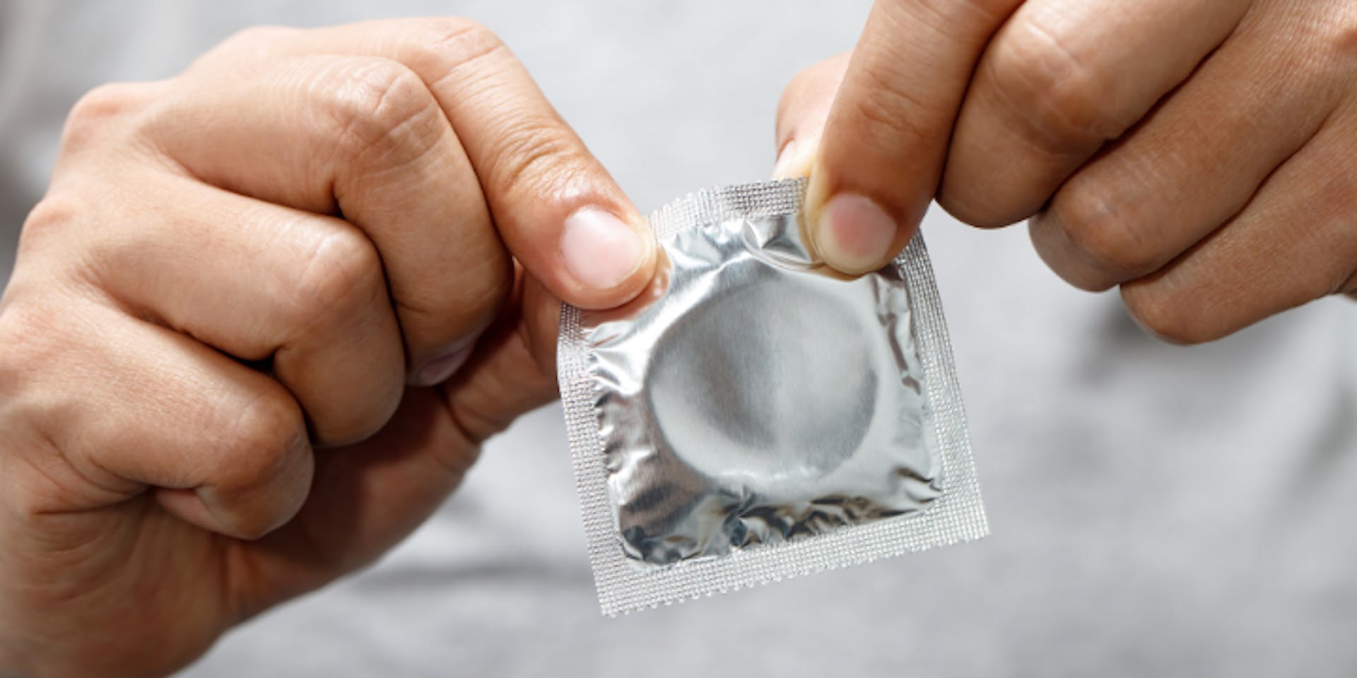 Carefully open your condom and remove the wrapper