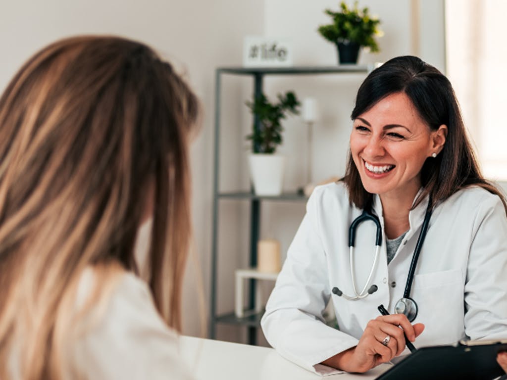 Image showing a clinician speaking with a patient