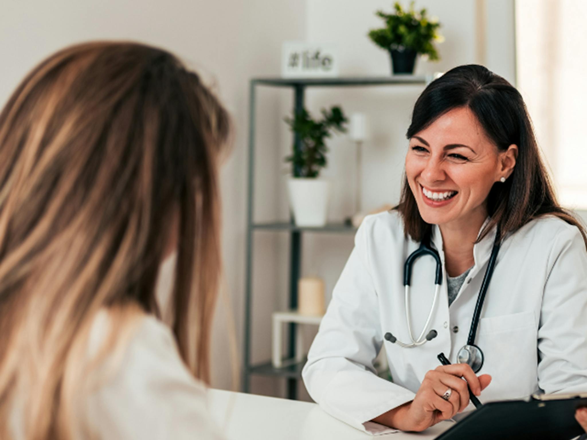 Image showing a clinician speaking with a patient