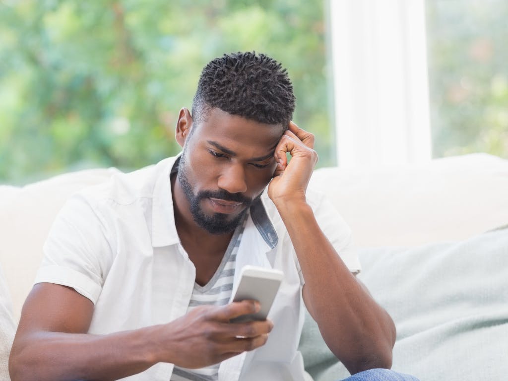 Image showing a person looking at there mobile device