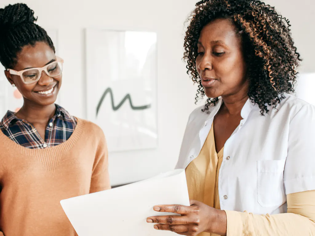 Image showing a clinician speaking with a patient