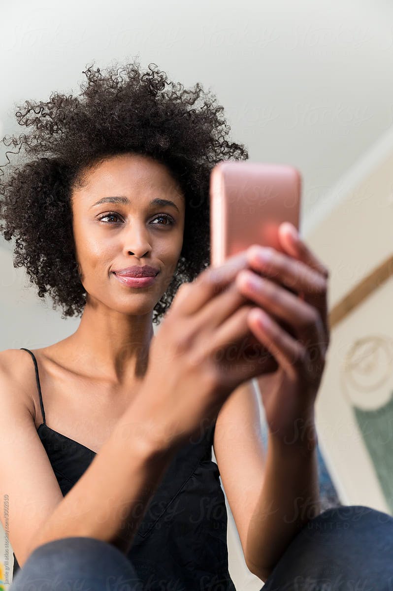 User looking at their phone for help and support