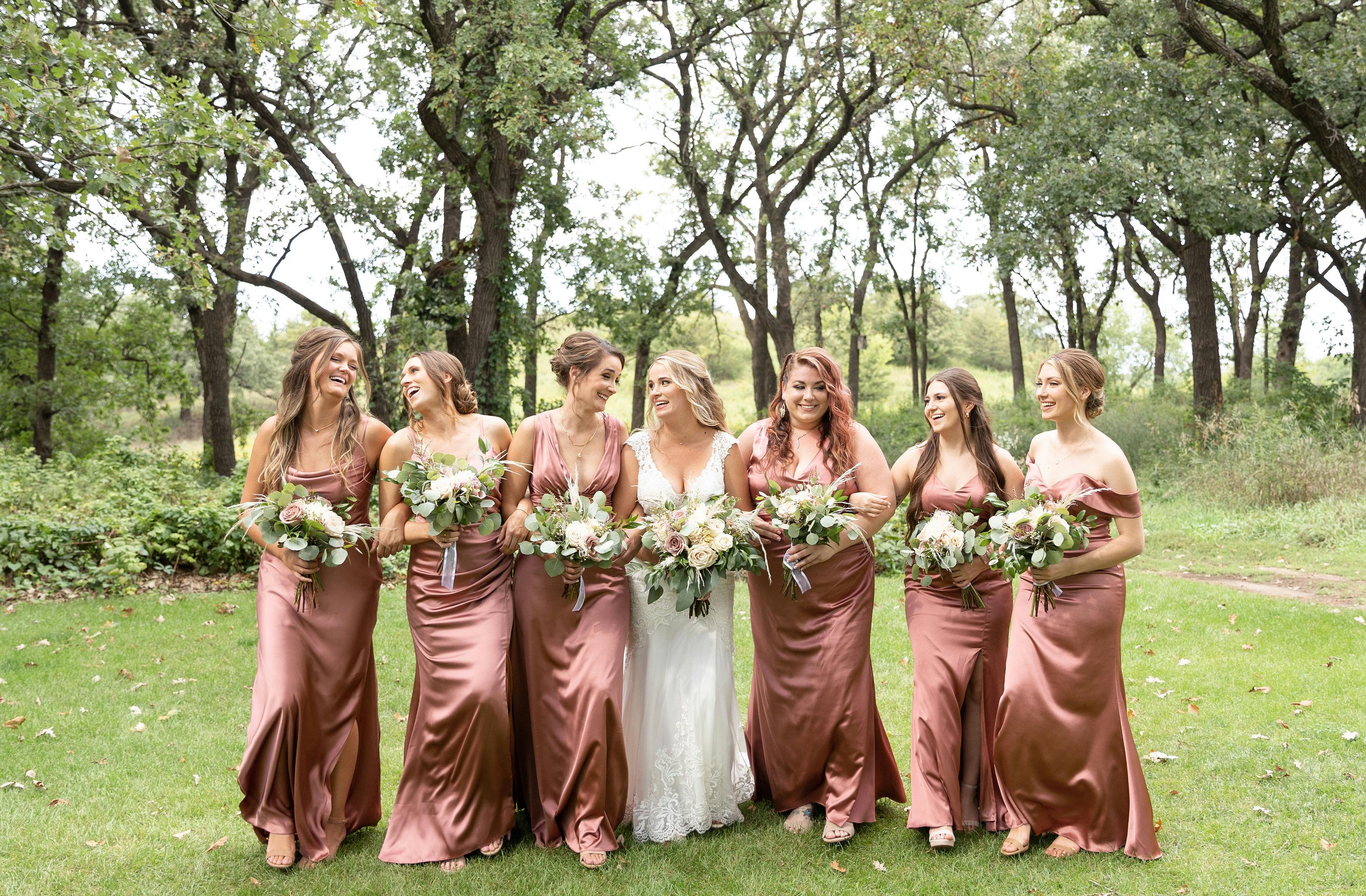 Full glam bridal party walking with bride