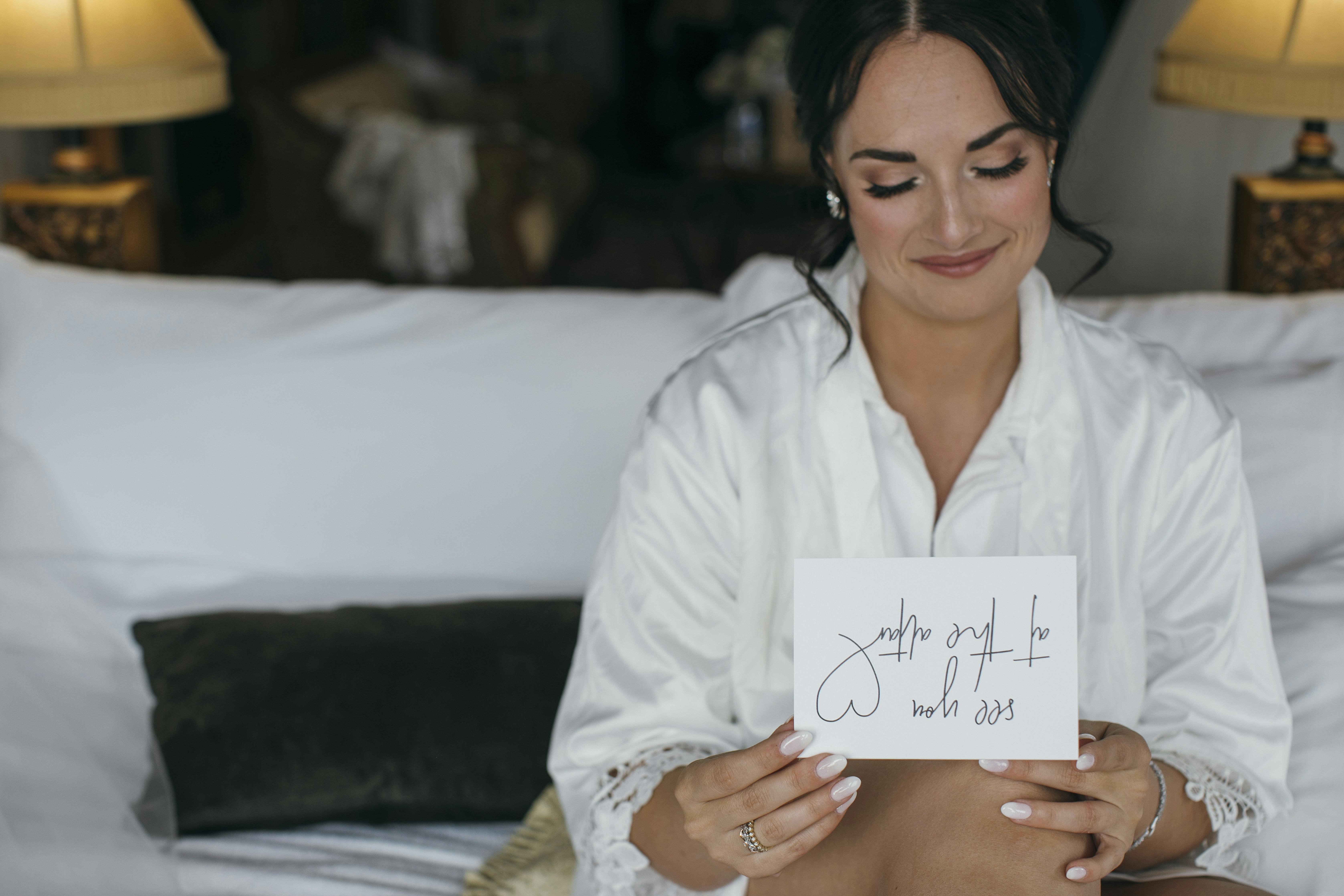 glamorous bride reading note from her fiance