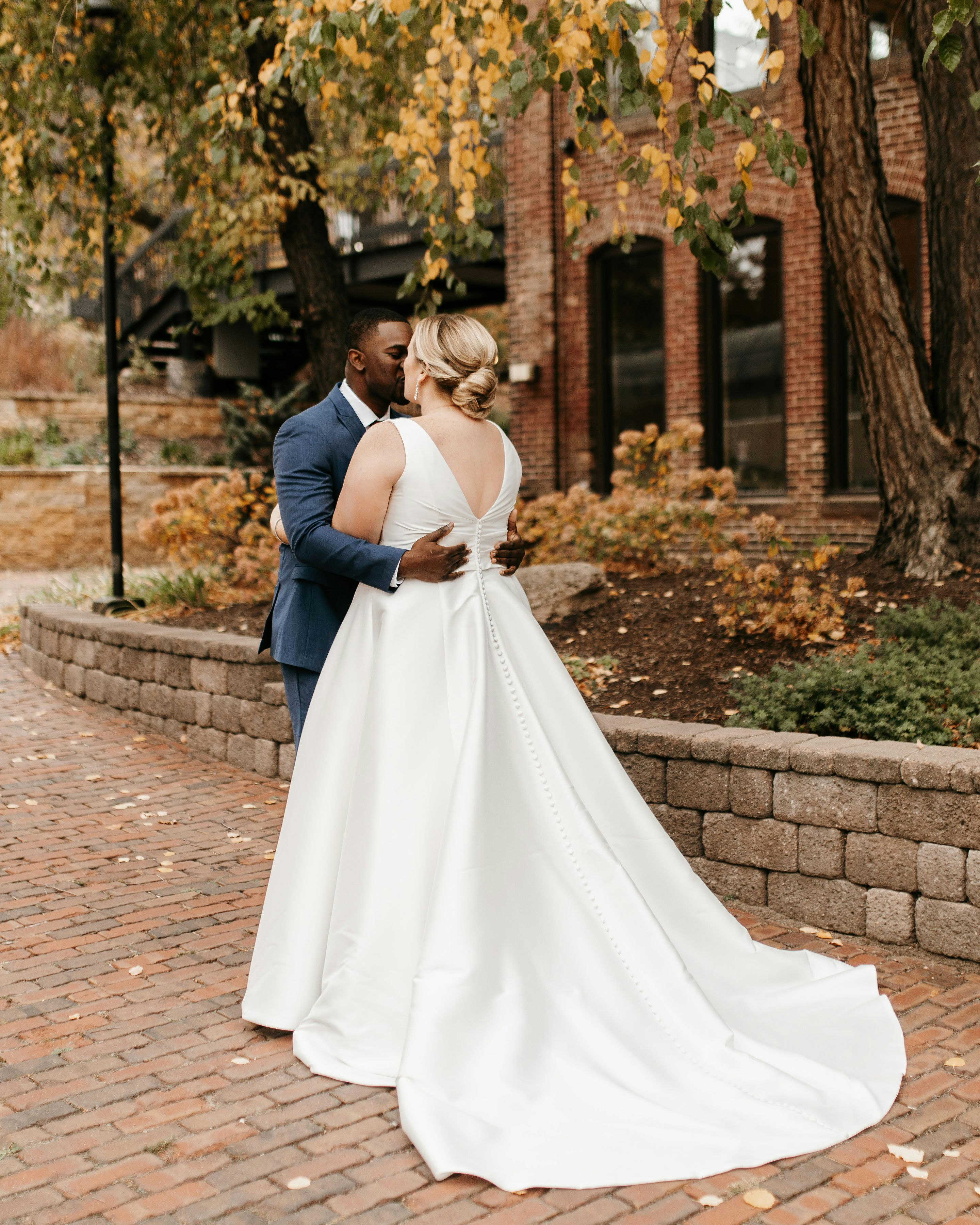 Bride and groom kissing outside of Minneapolis Event Centers