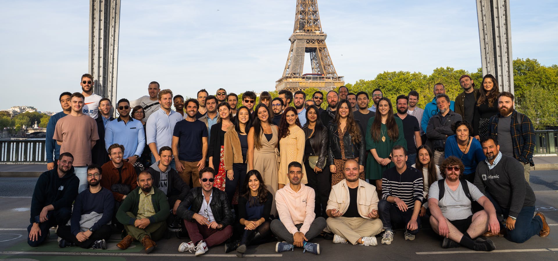 Picture of the Prismic team in Paris in front of the Eiffel tower