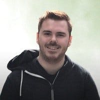 portrait of Eddy Vinck smiling and wearing a hoodie.