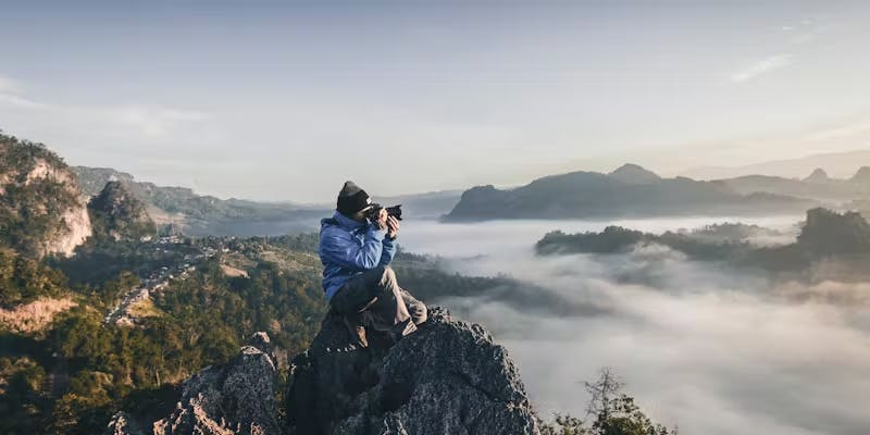 Photographer on mountain
