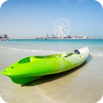 green kayak at the beach in JBR Dubai