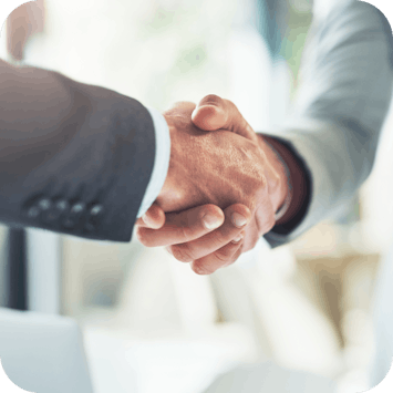 Corporate clients shaking hands after a business deal Corporate clients shaking hands after a business deal