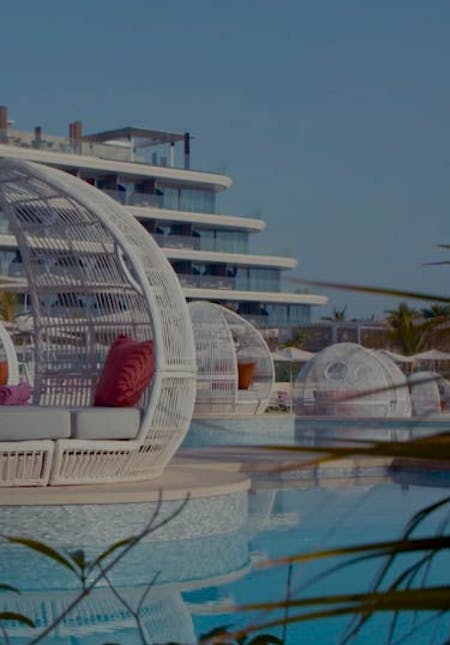 cabanas by the pool in the w dubai the palm