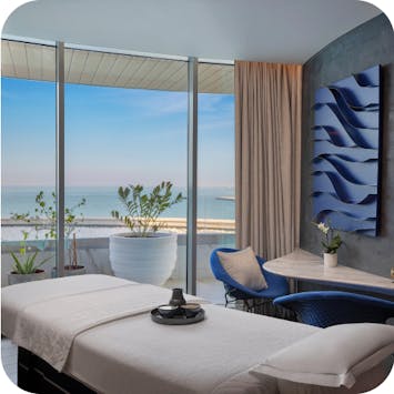 Luxury spa treatment room with ocean views. 
